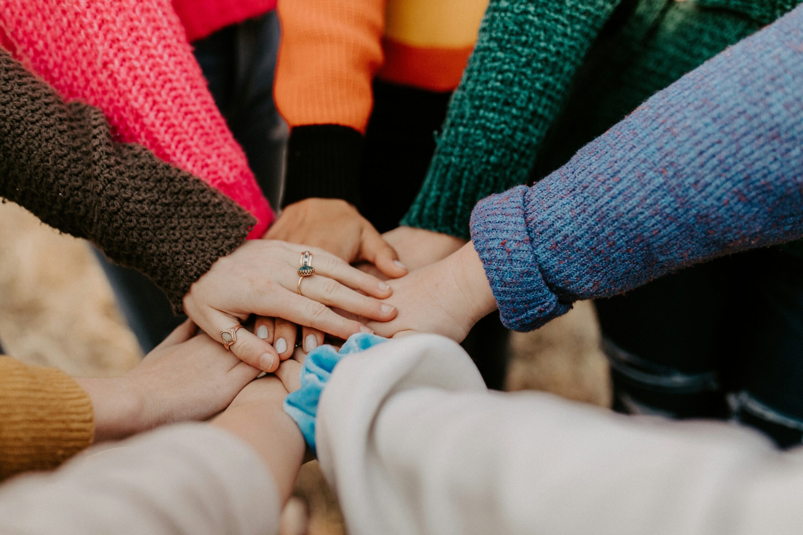 Group holding hands by Hannah Busing