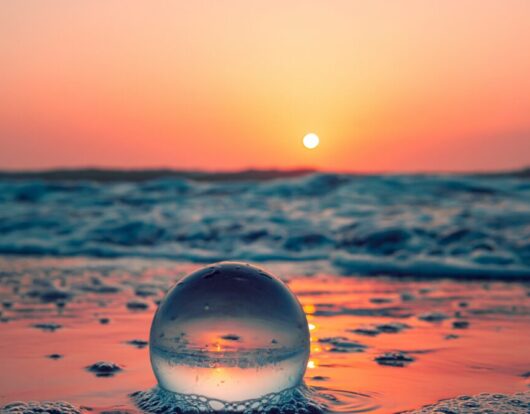 Sunset out to sea by Photo by Joshua Woroniecki