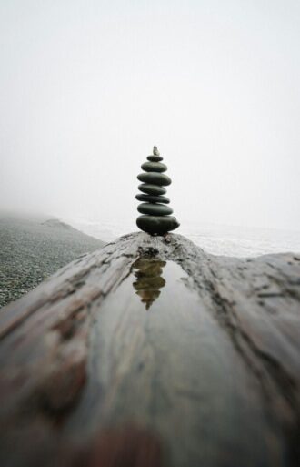 Balancing rocks at the beach by Karsten Winegeart