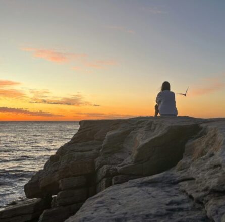 Watching the sunset on the rocks by Miriam Alcorn